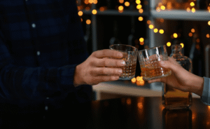 people drinking bourbon in a bar